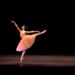Picture of Theresa dancing on stage.